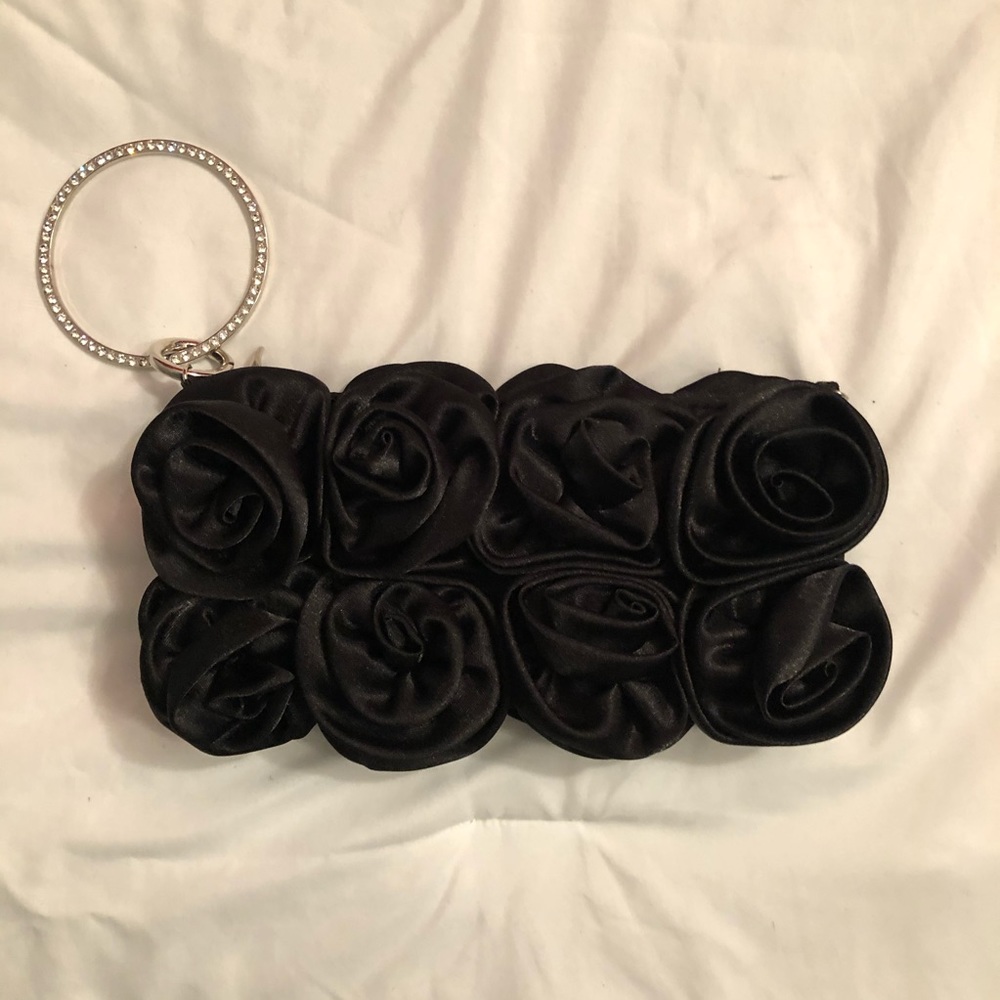 Black rosette wristlet clutch.